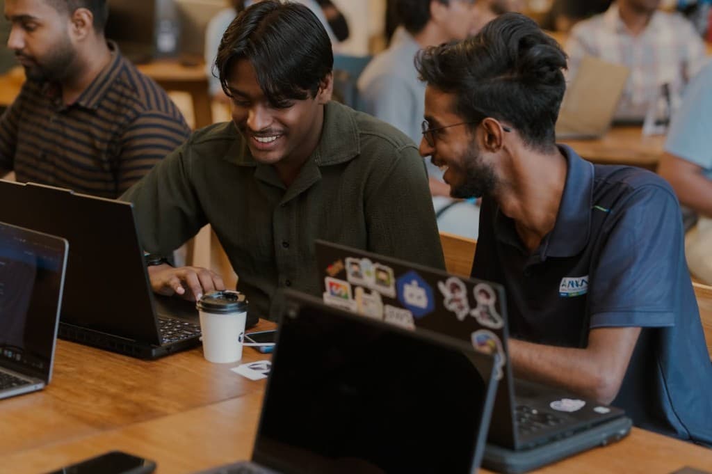 Coding buddies laughing